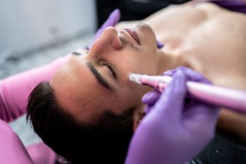 man receiving an aesthetic facial treatment at a beauty clinic.